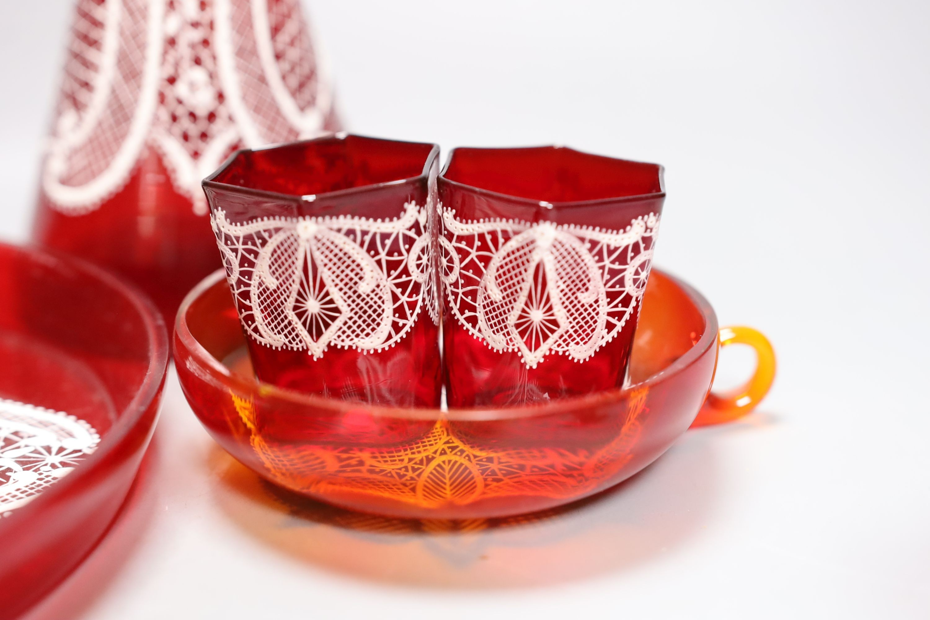 A Venetian red enamelled glass lace-pattern liqueur set